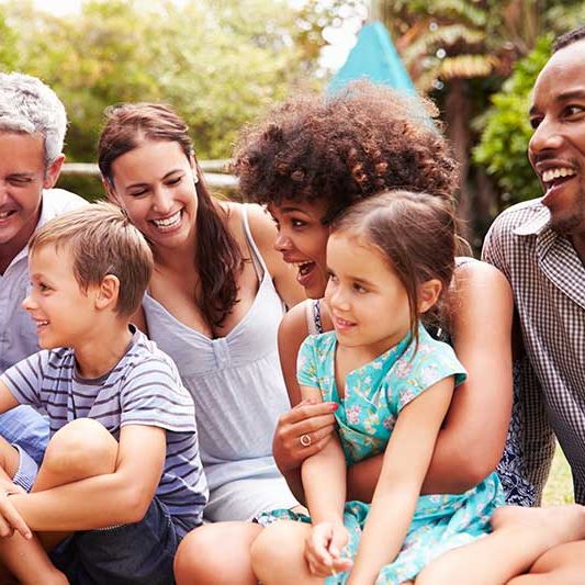 A community gathering of adults and children 